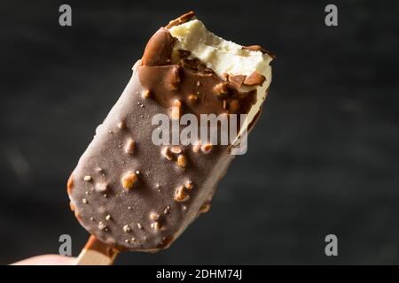 Frozen Chocolate Covered Ice Cream Bars with Nuts Stock Photo