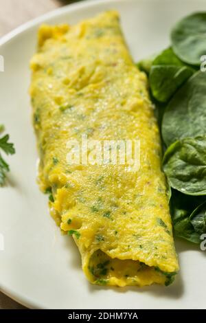 Homemade Breakfast French Omelette with Herbs and Greens Stock Photo