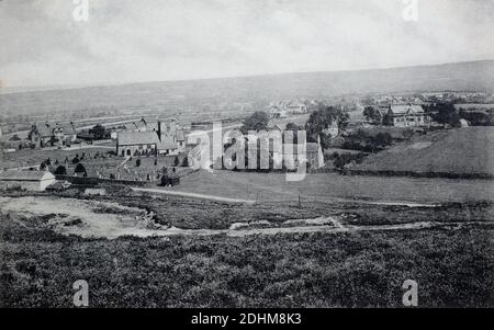 A historical view from the moors North to St Mary's Church and  the Mallyan Spout Hotel in Goathland, Yorkshire, England, UK, taken from a postcard c. 1905. Stock Photo