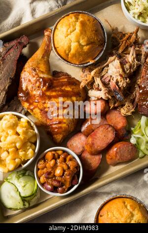 Homemade Barbecue Platter with Ribs Chicken Brisket and Pulled Pork Stock Photo