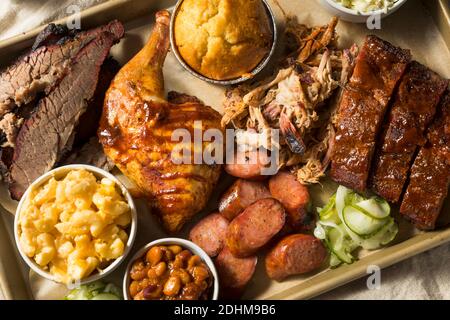 Homemade Barbecue Platter with Ribs Chicken Brisket and Pulled Pork Stock Photo