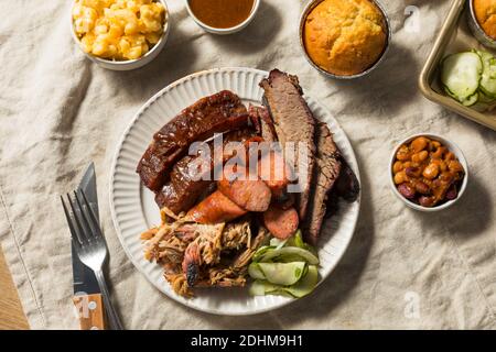 Homemade Barbecue Platter with Ribs Chicken Brisket and Pulled Pork Stock Photo