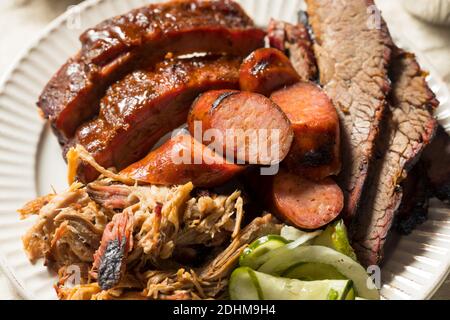 Homemade Barbecue Platter with Ribs Chicken Brisket and Pulled Pork Stock Photo