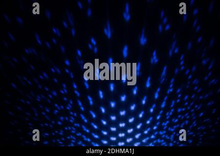 Blue Lighting effect on dark wall, defocused decorative abstract background. Stock Photo