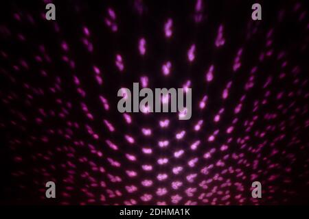 Red Lighting effect on dark wall, defocused decorative abstract background. Stock Photo