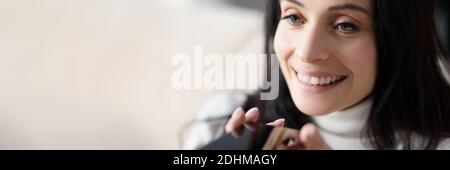 Woman uses voice dialing in smartphone closeup Stock Photo