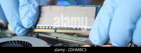 Replacing computer board in a laptop closeup Stock Photo