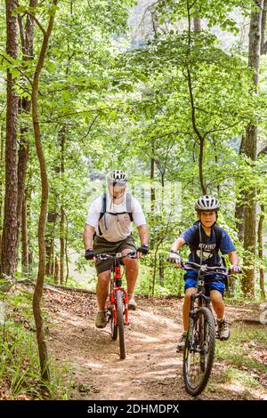 Birmingham Alabama,Oak Mountain State Park,mountain bike trail man father boy son riding bicycles, Stock Photo