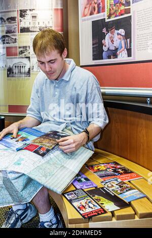 Huntsville Alabama,Visitors Center centre,man visitor reading brochure leaflet folder pamphlet information map, Stock Photo