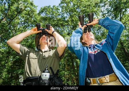 Alabama Decatur Hospitality Nature Park birding birder,man binoculars woman female couple looking, Stock Photo