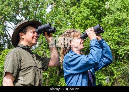 Alabama Decatur Hospitality Nature Park birding birder,man binoculars woman female couple looking, Stock Photo