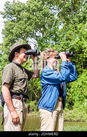 Alabama Decatur Hospitality Nature Park birding birder,man binoculars woman female couple looking, Stock Photo