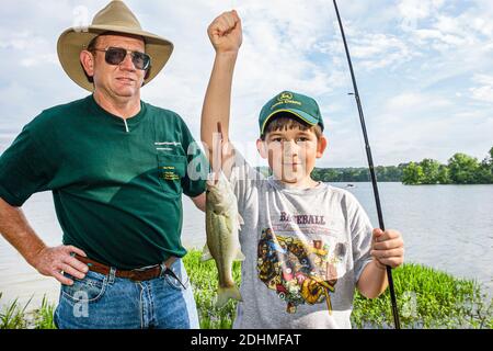 Alabama Lake Eufaula Lakepoint Resort State Park,Chattahoochee River boy kid man fishing father son, Stock Photo