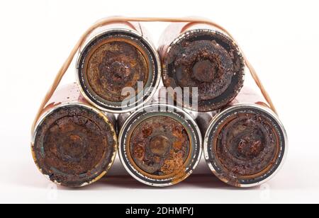Leaked batteries in detail isolated on white background Stock Photo