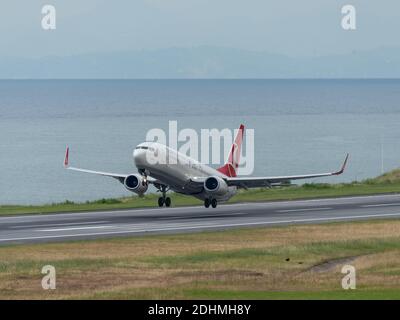 TRABZON, TURKEY - JULY 08, 2016: Turkish Airlines jet taking off from Trabzon airport in a windy weather. Stock Photo