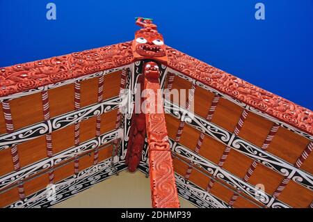 Carvings on The Meeting House (Wharenui), Whakarewarewa Living Thermal Village, Rotorua, Bay of Plenty Region, North Island, New Zealand Stock Photo