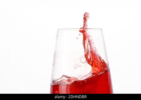 Red juice splashes on isolated white background Stock Photo