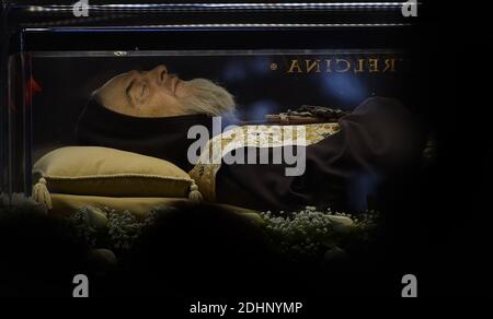 The embalmed corps of Padre Pio is exposed in Saint Peter's Basilica for veneration by the faithful in connection with the ongoing Extraordinary Jubilee Year of Mercy at the Vatican, on Feb. 6, 2016.The embalmed corps of the Catholic saint Italian friar Padre Pio (1887-1968) went on display in St Peter's basilica after being paraded through nearby streets in transparent coffin.Nearly half a century after this death, the body of Padre Pio was moved for the first time from its resting place in a sanctuary at San Giovanni Rotondo in southern Italy.It has been brought to the Vatican at the request Stock Photo