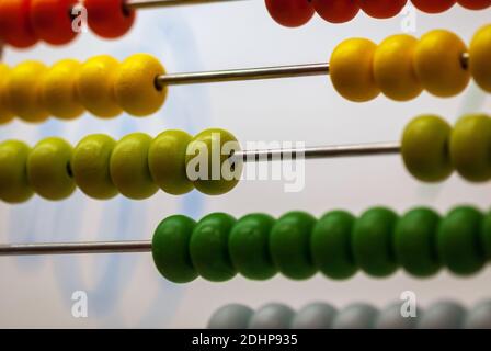 Close up of children's abacus with wooden beads of different colors Stock Photo