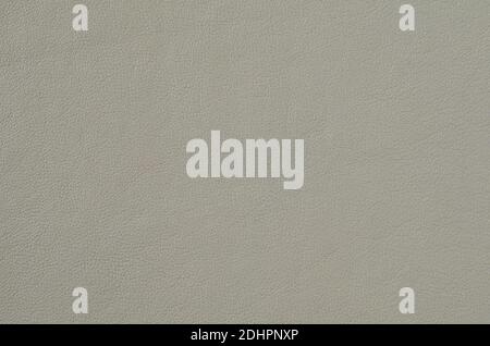 Grey soft leather for the background. Natural leather texture Space for text on the gray background of the skin close up. Artificial leather from poly Stock Photo