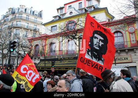 Protesters pass by Le Bataclan concert hall as they take part in a demonstration in Paris, France, on March 9, 2016, as part of a nationwide day of protest against proposed labour reforms. France faced a wave of protests on March 9 against deeply unpopular labour reforms that have divided an already-fractured Socialist government. Photo by Alain Apaydin/ABACAPRESS.COM Stock Photo