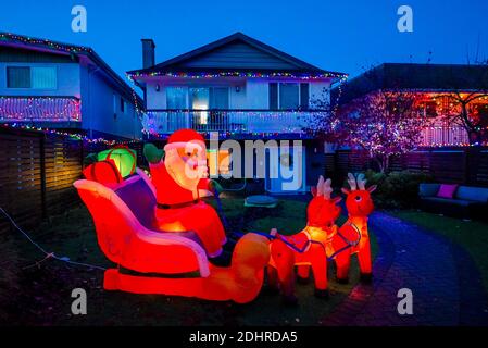 Santa with sleigh and reindeer, Christmas Light display, Trinity Street, Vancouver, British Columbia, Canada Stock Photo