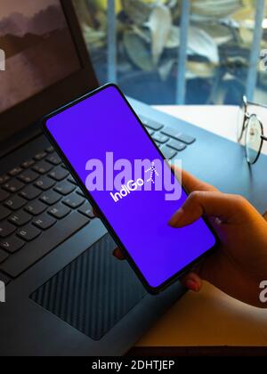 Assam, india - December 20, 2020 : Indigo logo on phone screen stock image. Stock Photo