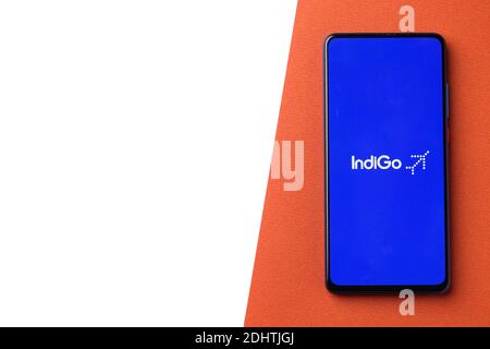 Assam, india - December 20, 2020 : Indigo logo on phone screen stock image. Stock Photo