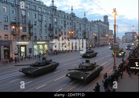 T-14 Armata tanks are seen at the central street.Military equipment on Tverskaya Street before moving towards Red Square for a rehearsal for the Victory Day parade in central Moscow. Stock Photo