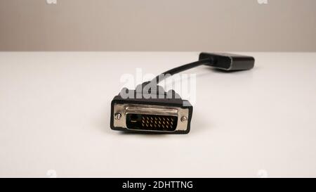Dvi, vga monitor cable on white table. Wire, black cord and plug. Connect to PC. Stock Photo
