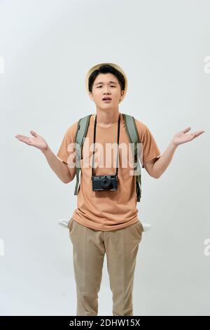 Portrait of frustrated tourist man over white background Stock Photo