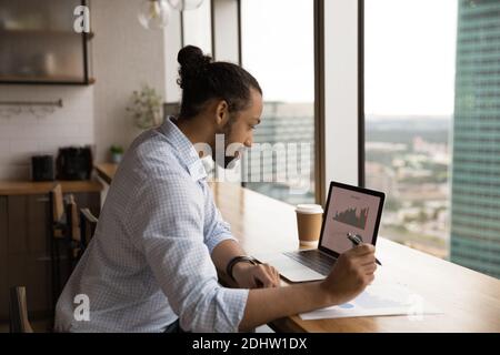 African American male worker work on laptop in office Stock Photo
