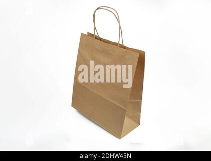ecological kraft package with handles for shopping in store and delivery on isolated white background Stock Photo