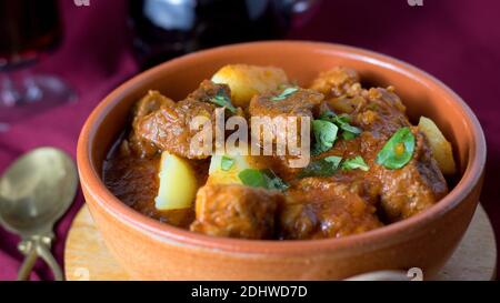 Pork variation on burgundy beef served in earthenware pot with red wine Stock Photo