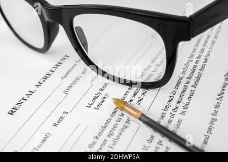 Detail Of A Rental Agreement For An Apartment Or Home Being Signed, Including Monthly Rent And Security Deposit Stock Photo
