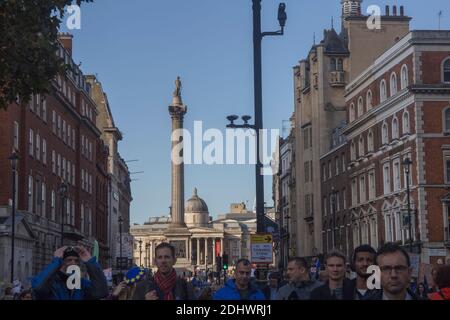 Nelson’s Column overlooking anti-Brexit protestors marching down Whitehall Stock Photo