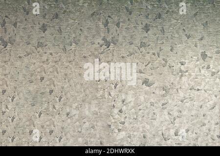 Mosaic sheet metal texture with asymmetric figure patterns as an abstract background. Stock Photo