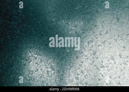 Degraded shadow on a metal plate with strange geometric drawings painted on its surface. Abstract dark background with bright texture bumps and spots. Stock Photo