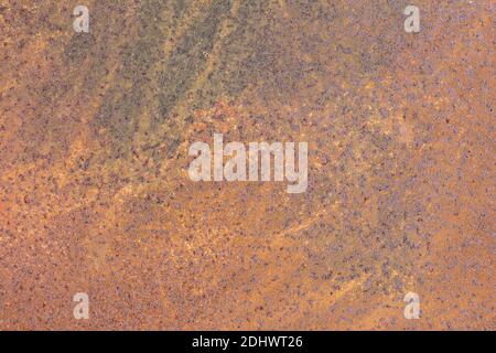 Iron texture or background with rusty peeling orange paint. Abstract art with a place for text. Stock Photo