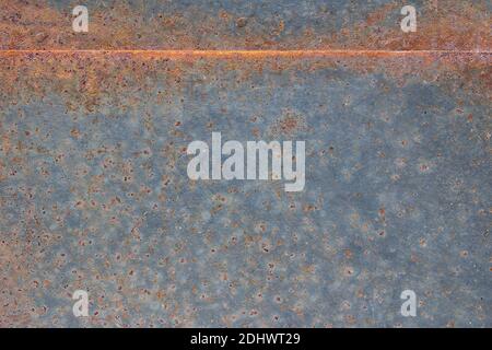 Grunge rusted metal texture, rust, and oxidized metal background. Old metal iron panel. Abstract art with a line and space to input text. Stock Photo