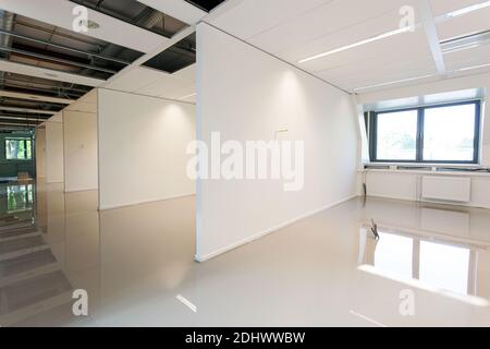 LAREN, THE NETHERLANDS - MAY 16, 2012: A room with a freshly added coating layer to create a synthetic cast floor installation. Stock Photo