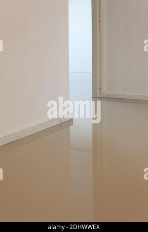 LAREN, THE NETHERLANDS - MAY 16, 2012: An indoor floor with a freshly added coating layer to create a synthetic cast floor installation. Stock Photo