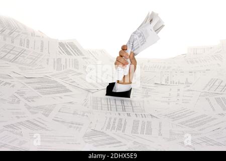 Stress durch zuviel Buerokratie, Mann erstickt in Papier, Insolvenz, Pleite, MR: Yes Stock Photo