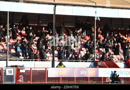 Crawley UK 12th December 2020 -  Crawley fans watch the Sky Bet EFL League Two match between Crawley Town and Barrow AFC  at the People's Pension Stadium - Editorial use only. No merchandising.  - for details contact Football Dataco  : Stock Photo