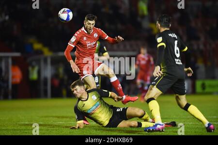 Crawley UK 12th December 2020 -  Ashley Nadesan of Crawley is brought down by Matthew Platt of Barrow for a penalty during the Sky Bet EFL League Two match between Crawley Town and Barrow AFC  at the People's Pension Stadium - Editorial use only. No merchandising.  - for details contact Football Dataco  : Credit Simon Dack TPI / Alamy Live News Stock Photo