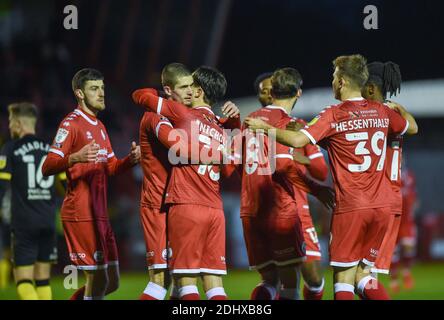 Crawley UK 12th December 2020 -  Tom Nichols of Crawley is mobbed  after scoring their third goal during the Sky Bet EFL League Two match between Crawley Town and Barrow AFC  at the People's Pension Stadium - Editorial use only. No merchandising.  - for details contact Football Dataco  : Credit Simon Dack TPI / Alamy Live News Stock Photo
