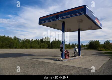 Lonely gas station with only two pumps on the Richardson Highway in Alaska at the end of a sunny day in summer. Stock Photo