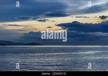 sunset in  Vigo estuary with a view of the horizon with clouds over the sea Stock Photo