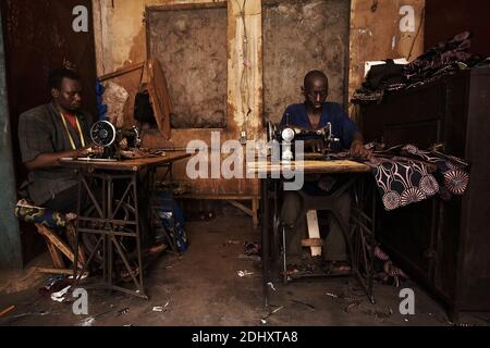 tailor working in workshop with sewing machine in Bamako ,Mali, West Africa. Stock Photo