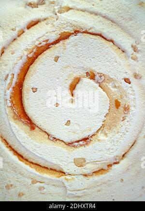Artistic Pattern and Texture of Salted Caramel Macadamia Nut Ice Cream for Background or Banner Stock Photo